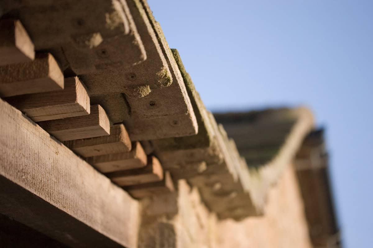 Close-up of Cotswold stone eaves detail with traditional tooth corbelling at Vale Farm